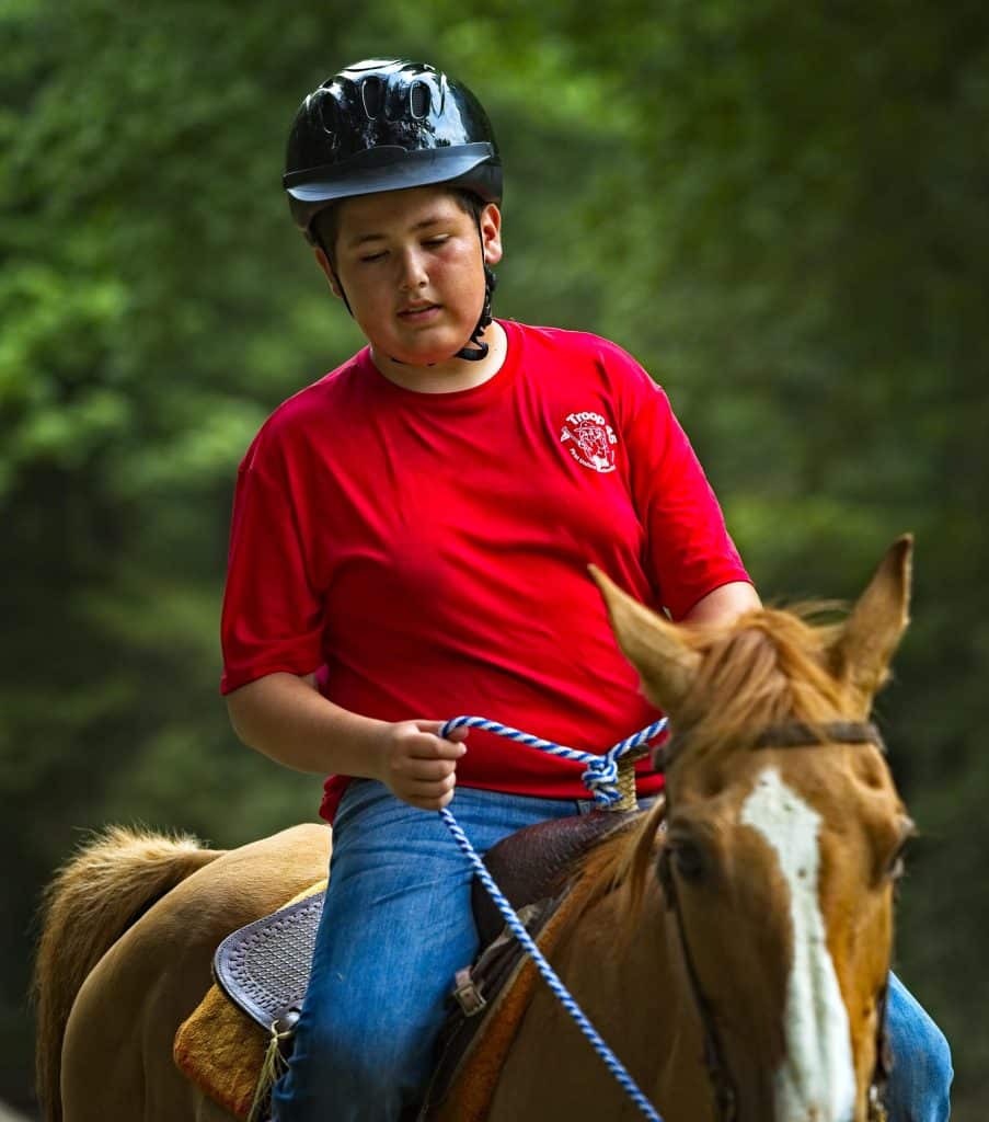 Scout riding a horse